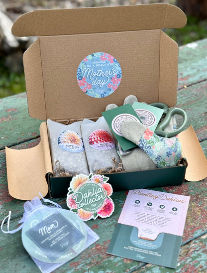 Box of gardening items with 'Mother's Day' sticker on a wooden surface